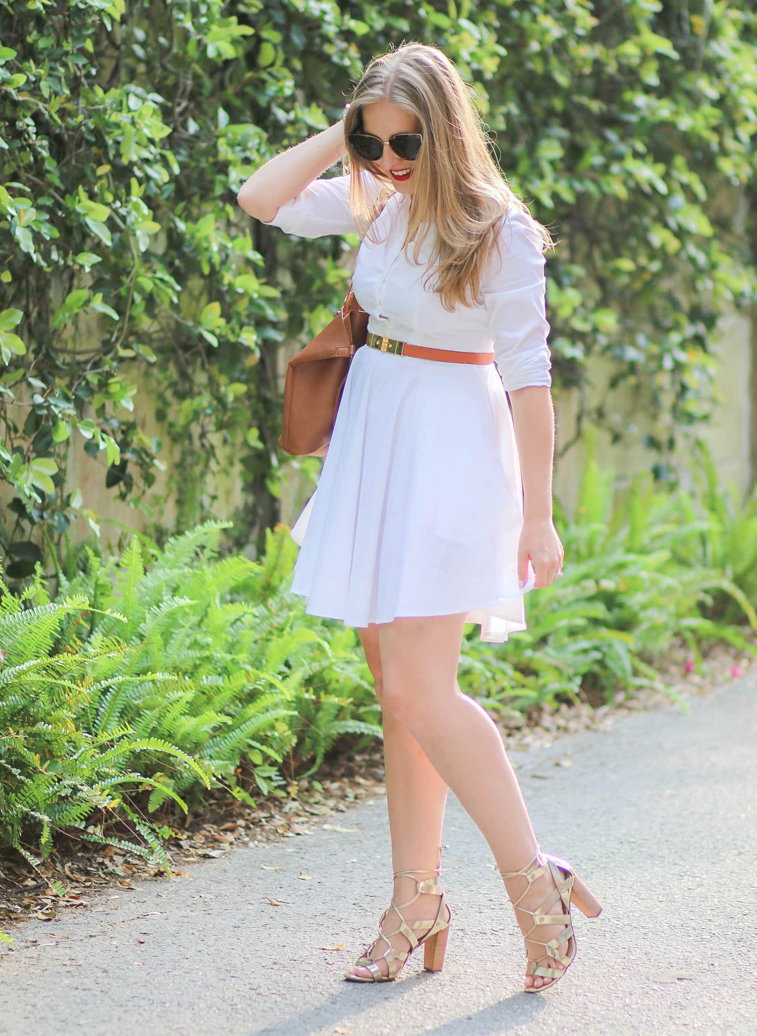 Every woman needs to own a white button-down collared dress. This cute Express dress is a classic closet staple that's perfect for work, dinner for friends, or even a date night! Click through this pin to see how Florida style blogger Ashley Brooke Nicholas styled this dress with a cognac and gold belt and the most beautiful gold lace-up heels from Banana Republic + learn how she got new hair for the season thanks to Hair Cuttery! | #MyHCLook sponsored by Hair Cuttery