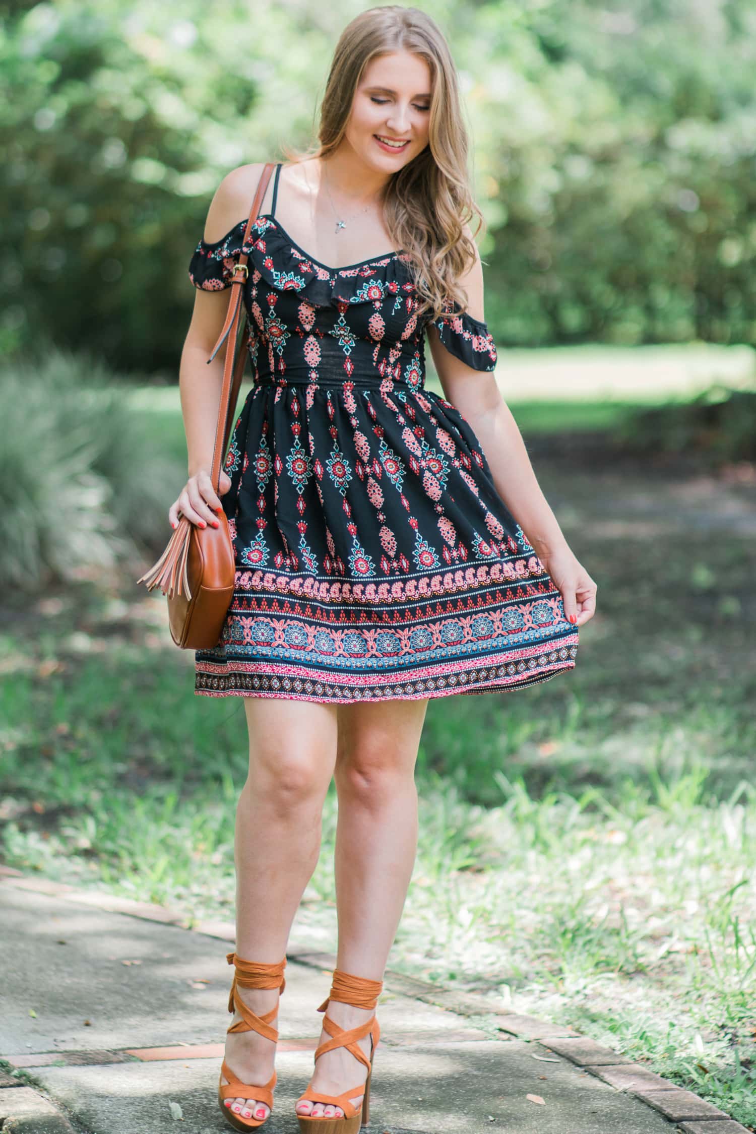 A girl can never own too many dresses- especially in the summertime! My go-to summer date night look is an off-the-shoulder sundress with cognac lace-up heels and soft curls. In addition to being a cute summer outfit idea, it's also extremely affordable. Everything in this look is under $40! Click through this pin to see the full look from Ashley Brooke Nicholas! | #MyHCLook sponsored by Hair Cuttery