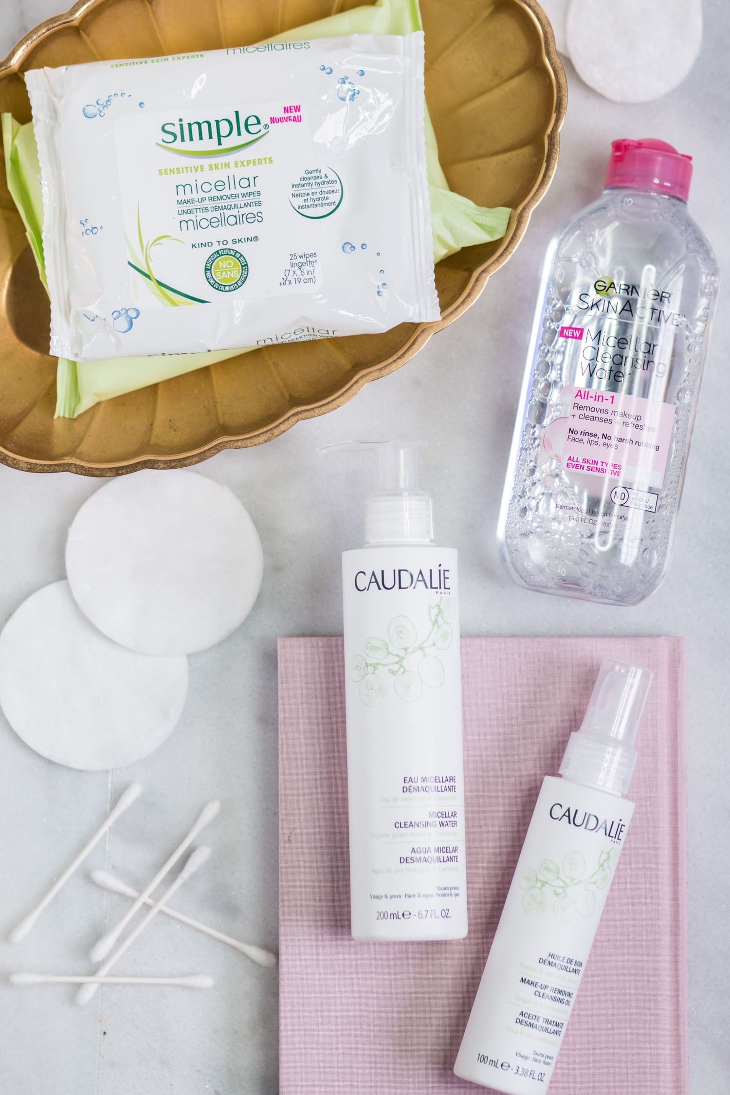 The best new skincare products for women in their 20s - including the best makeup removers + a review of Simple Micellar Make-Up Remover Wipes, Garnier SkinActive Micellar Cleansing Water & Makeup Remover, Caudalie Micellar Cleansing Water, and Caudalie Make-Up Removing Cleansing Oil by beauty blogger Ashley Brooke Nicholas
