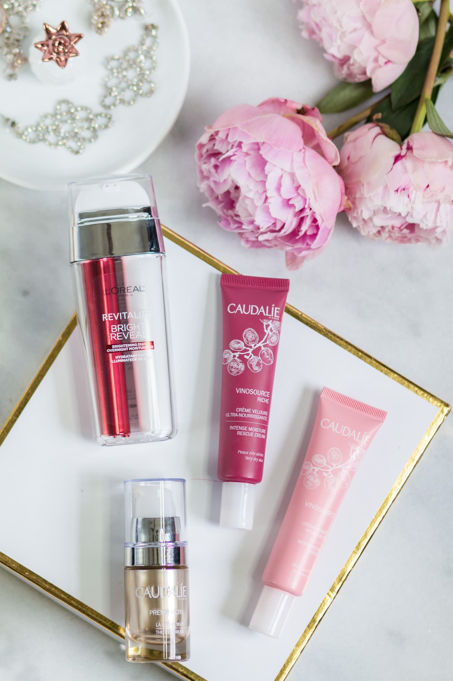 The best new skincare products for women in their 20s - including the best anti-aging moisturizers and eye creams + a review of L’ORÉAL Revitalift Bright Reveal Dual Overnight Moisturizer, Caudalie Vinosource Intense Moisture Rescue Cream, Caudalie Vinosource Moisturizing Sorbet, and Caudalie Premier Cru Eye Cream by beauty blogger Ashley Brooke Nicholas