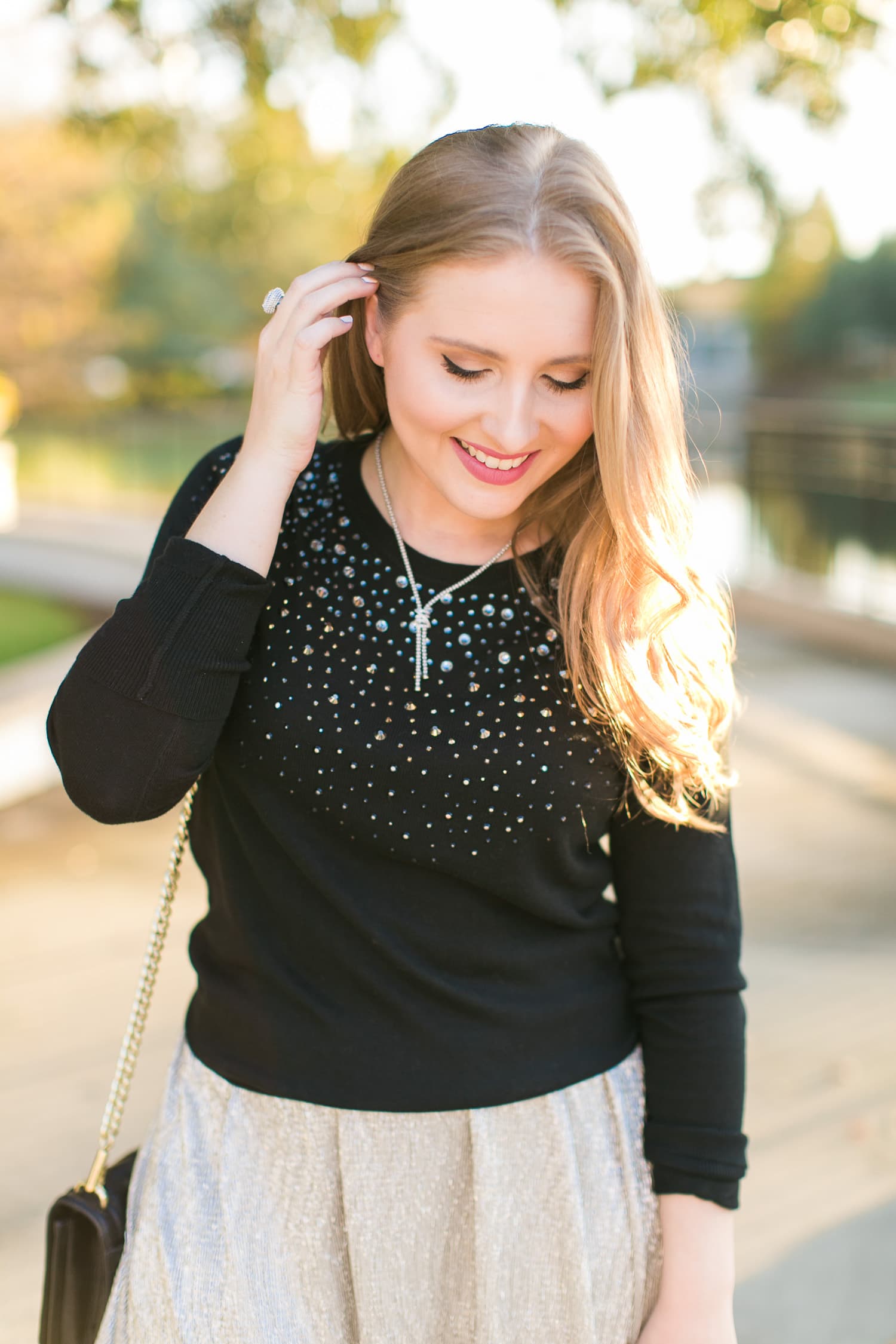 golden hour sunset outfit white skirt black sweater