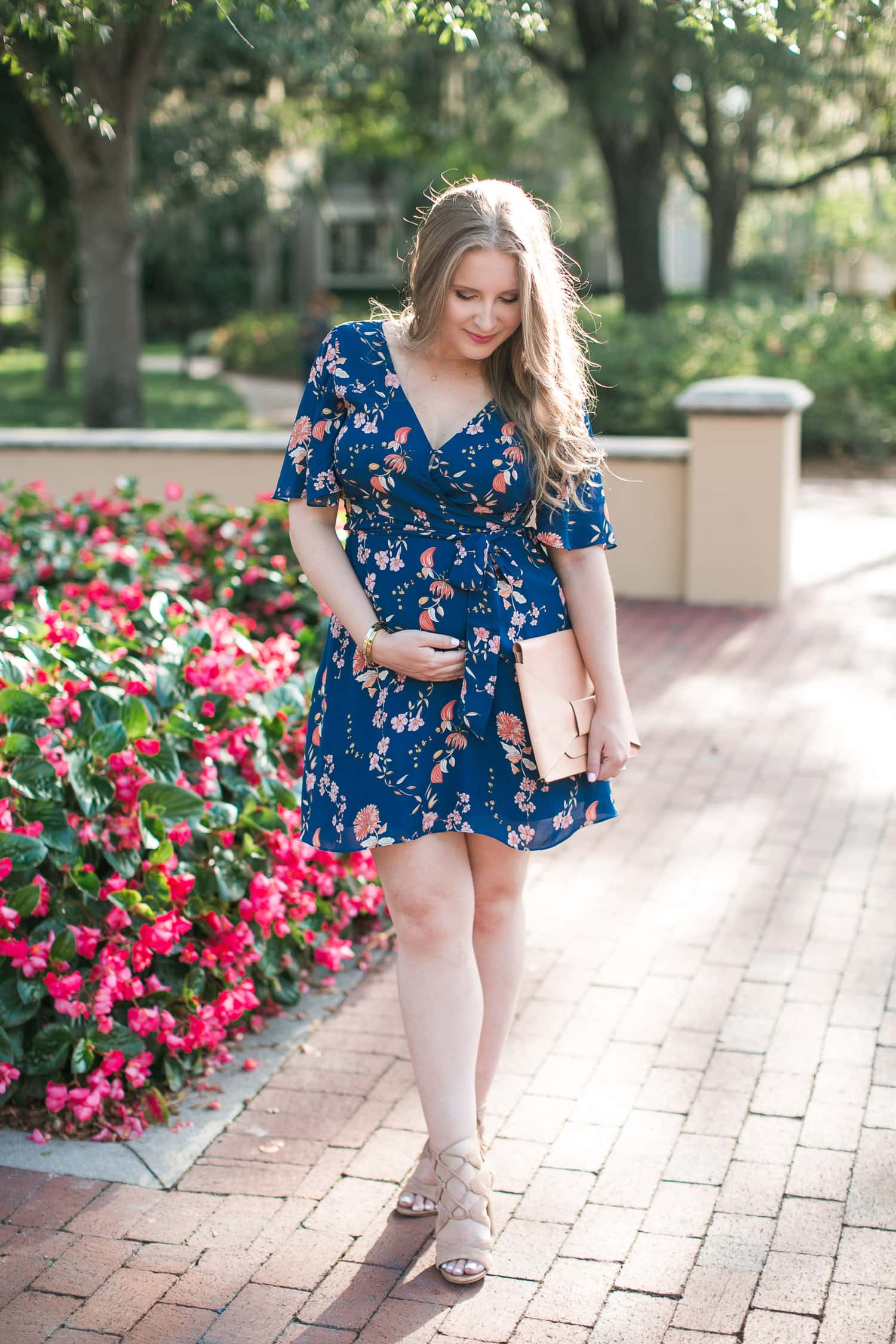 Affordable and maternity-friendly floral wrap dress under $100 styled by Florida fashion and personal style blogger Ashley Brooke Nicholas | BB Dakota Laselle Cherry Blossom Printed Wrap Dress | Maternity Style, maternity fashion, mommy to be, bump style, bump friendly outfits, maternity outfit idea, Sam Edelman Yardley Heeled Sandals, Banana Republic Bow Clutch, nude lace-up sandals, affordable outfit ideas, preppy fashion, preppy style